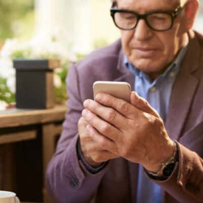 Man In Sport Coat Using Smart Phone